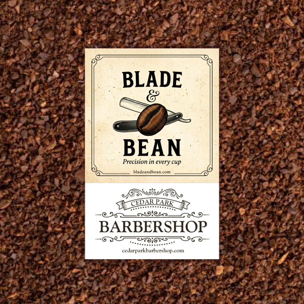 A rectangular barbershop sign or label centered over a background of dark brown coffee beans. The top section is cream with black text reading 'BLADE & BEAN' and a coffee blade graphic; the bottom section is white with 'CEDAR PARK BARBERSHOP' and website text.