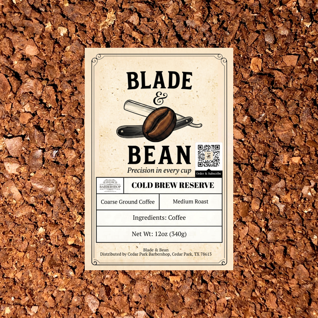 A rectangular product label for Blade & Bean Cold Brew Reserve coffee sits centered on a textured background of brown coffee beans. The label is cream-colored with black text and a graphic of a coffee bean and scoop.