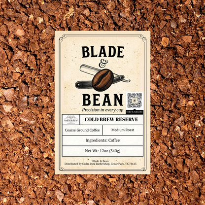 A rectangular product label for Blade & Bean Cold Brew Reserve coffee sits centered on a textured background of brown coffee beans. The label is cream-colored with black text and a graphic of a coffee bean and scoop.