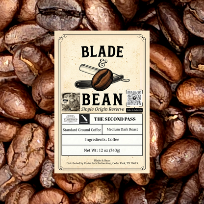 A centered product label for Blade & Bean coffee stands against a background of roasted coffee beans. The label reads 'BLADE & BEAN', 'Single Origin Reserve', and 'THE SECOND PASS', with additional text for standard ground coffee, medium dark roast, coffee ingredients, and net weight 12 oz (340g).
