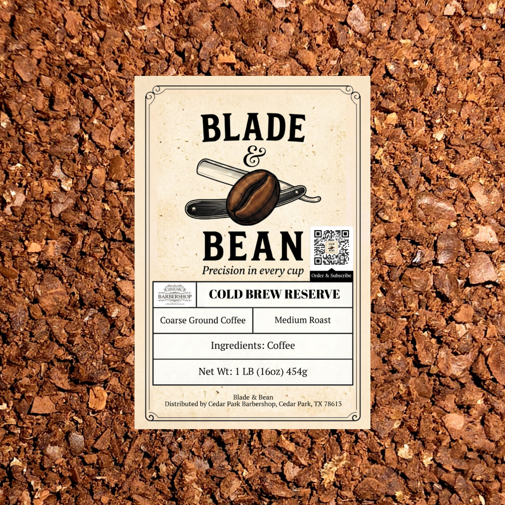 A rectangular coffee label reading BLADE & BEAN and COLD BREW RESERVE, placed on top of a textured background of brown coffee grounds. The label includes product details such as coarse ground coffee, medium roast, and net weight.