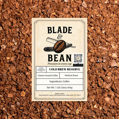 A rectangular coffee label reading BLADE & BEAN and COLD BREW RESERVE, placed on top of a textured background of brown coffee grounds. The label includes product details such as coarse ground coffee, medium roast, and net weight.