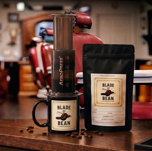 AeroPress coffee maker and Blade & Bean coffee package on a wooden surface with antique, 100 year old barber chairs in the background.