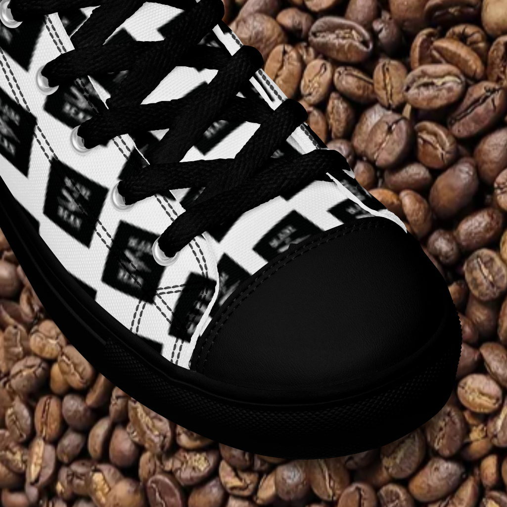 Black and white sneaker with a pattern on a bed of coffee beans