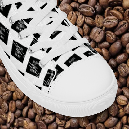 White sneaker with black pattern on a bed of coffee beans