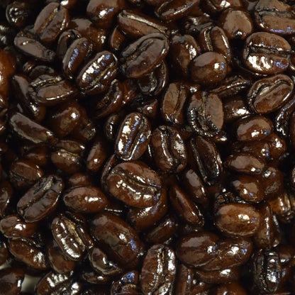 Close-up of dark French roasted coffee beans that are oily