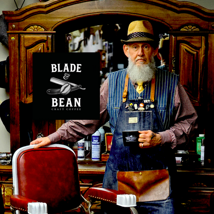 Barber in a barbershop holding a coffee cup with 'Vista Ridge Family Dentistry' branding.