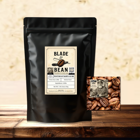 A black stand-up coffee bag labeled Blade & Bean Post Roast Coffee Roasted sits on a wooden surface against a textured beige wall, with a small square coffee bean pack placed beside it.