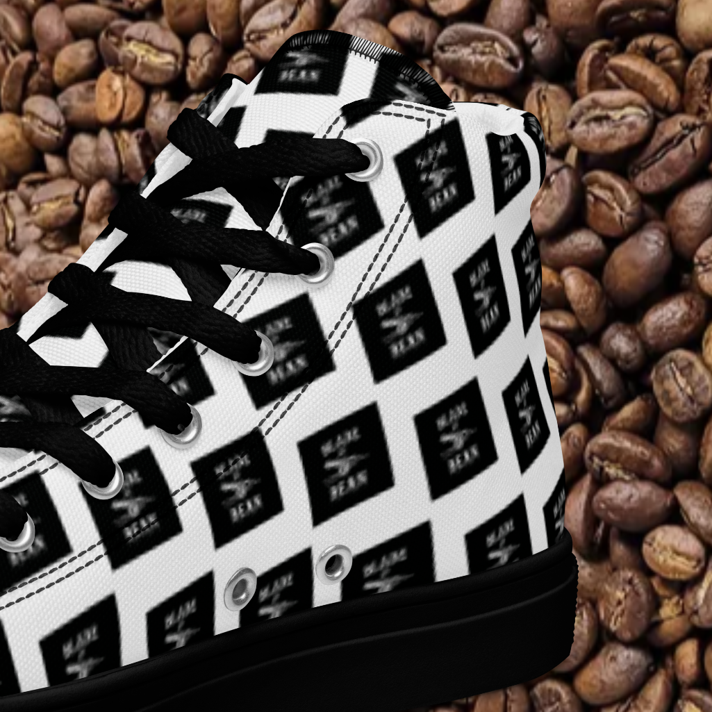Black and white sneaker with brand logo on a bed of coffee beans