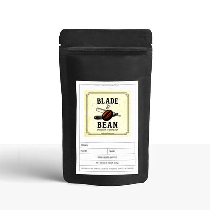 Black coffee bag with 'Blade & Bean' label on a white background