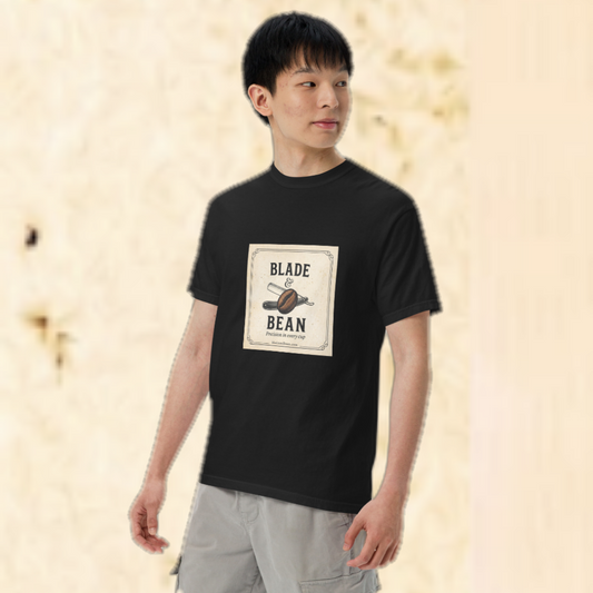 Person wearing a black t-shirt with 'Blade & Bean' logo on a beige background