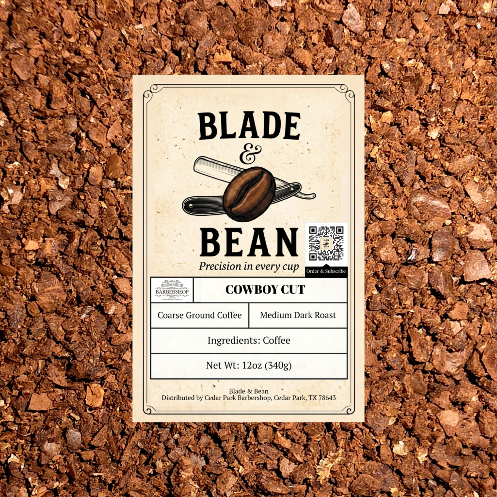 A rectangular coffee label reading BLADE & BEAN and COWBOY CUT, placed on top of coarse brown coffee grounds. The label shows a coffee bean illustration, a QR code, and product details including coarse ground coffee, medium dark roast, and net weight 12 oz (340g).