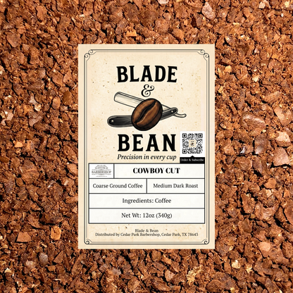 A rectangular coffee label reading BLADE & BEAN and COWBOY CUT, placed on top of coarse brown coffee grounds. The label shows a coffee bean illustration, a QR code, and product details including coarse ground coffee, medium dark roast, and net weight 12 oz (340g).