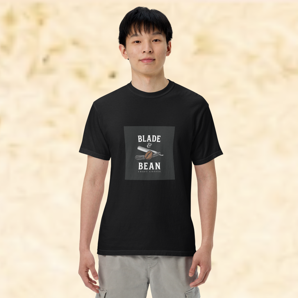 Person wearing a black t-shirt with 'Blade & Bean' logo on a beige background