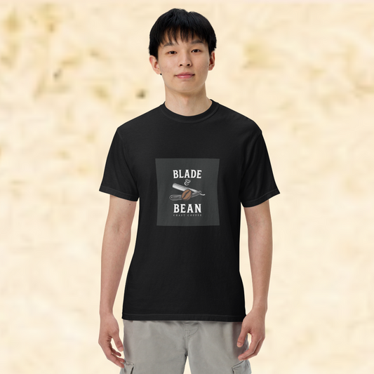 Person wearing a black t-shirt with 'Blade & Bean' logo on a beige background