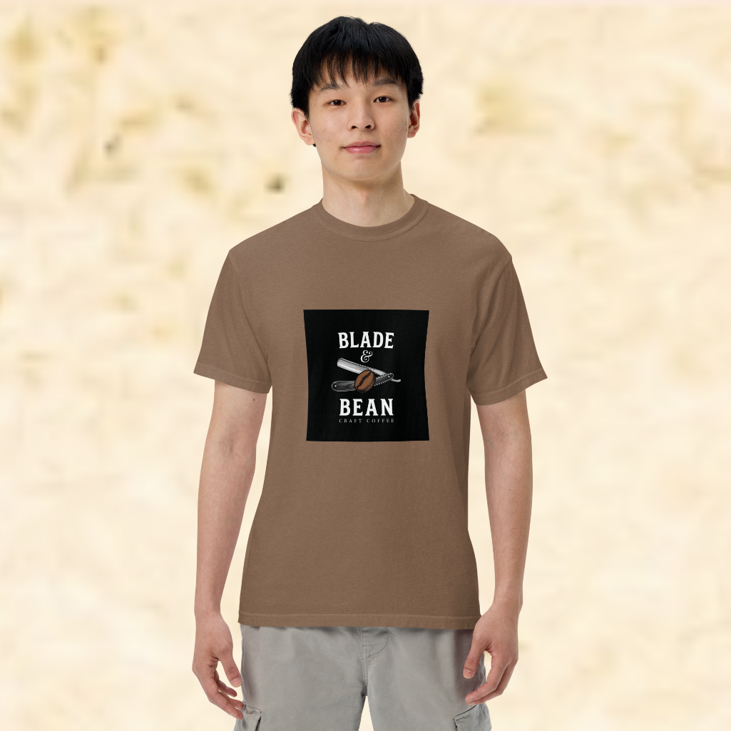 Person wearing a brown t-shirt with 'Blade & Bean' logo on a beige background