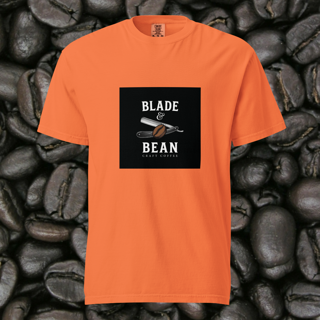Orange t-shirt with 'Blade & Bean' graphic on a background of coffee beans