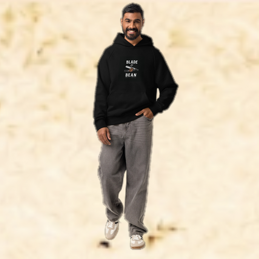 Man wearing a black hoodie with 'BLADE BEAN' logo on a beige background