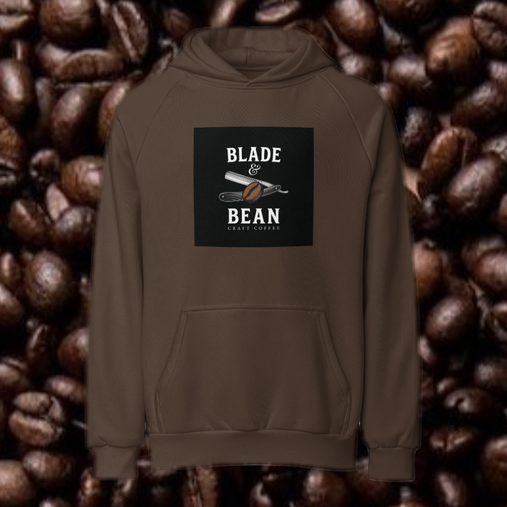 Brown hoodie with 'Blade & Bean' logo on a background of coffee beans