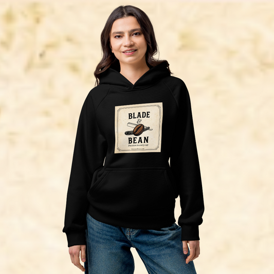 Person wearing a black hoodie with a graphic design on a beige background