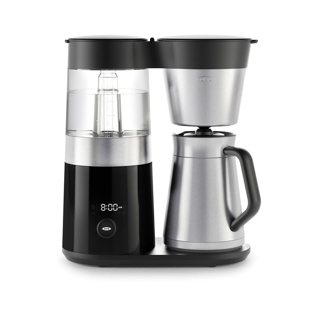 Black and silver coffee maker with digital display on a white background
