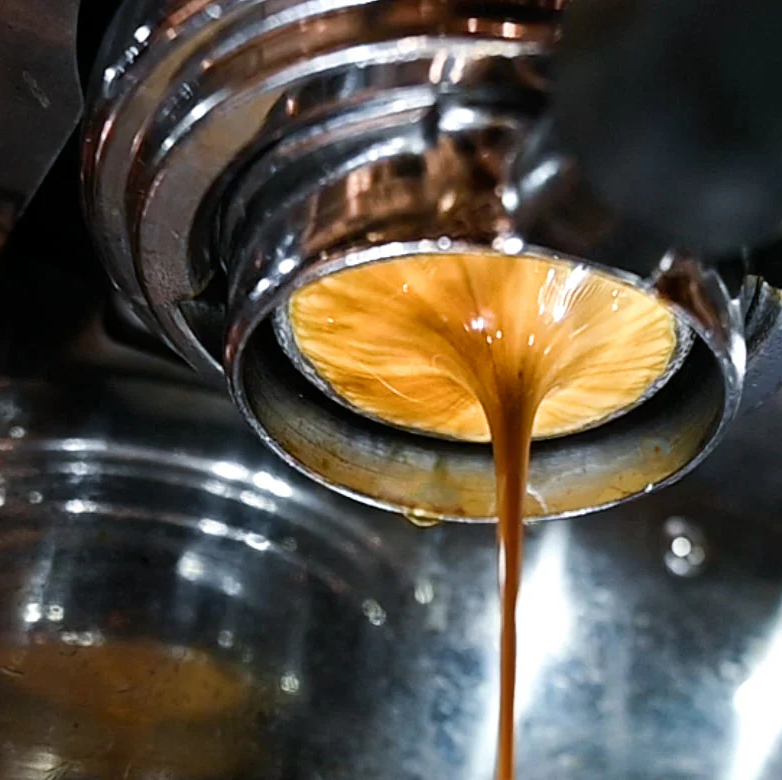 A shot of espresso being pulled close up