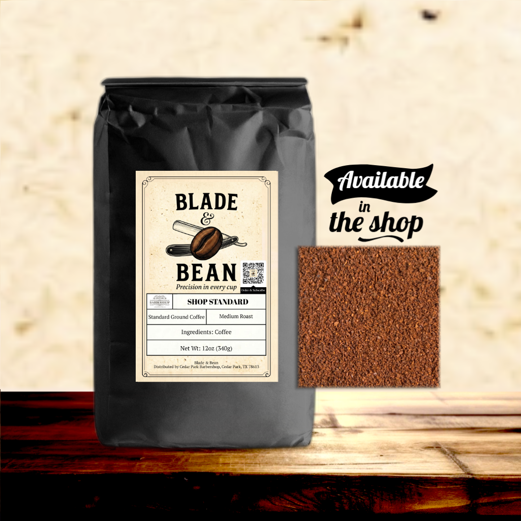 Coffee bag labeled 'Blade & Bean' with ground coffee sample on a wooden surface.
