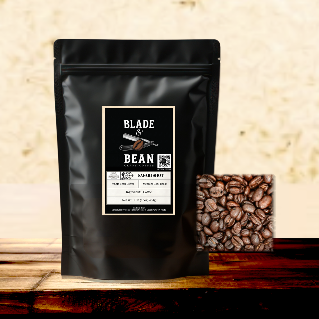 Black coffee bag with 'Blade & Bean' label and coffee beans on a wooden surface
