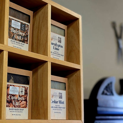 Handmade soap on a cubby display inside Cedar Park Barbershop
