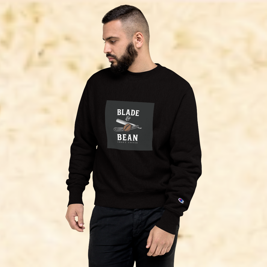 Man wearing a black sweatshirt with 'Blade and Bean' logo on a beige background