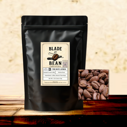 Black coffee bag with 'Blade Bean' label and coffee beans on a wooden surface