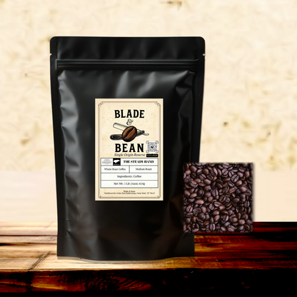 Black coffee bag with 'Blade Bean' label and roasted coffee beans on a wooden surface