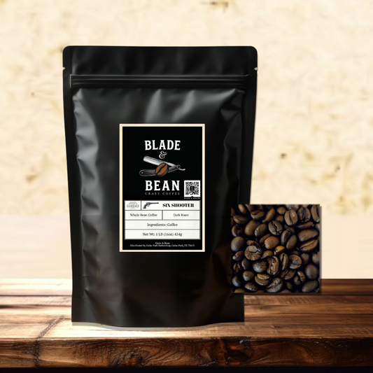 A black stand-up coffee pouch labeled Blade & Bean Coffee Roasters Symshooter sits on a wooden surface with a small inset showing roasted coffee beans against a warm beige textured background.