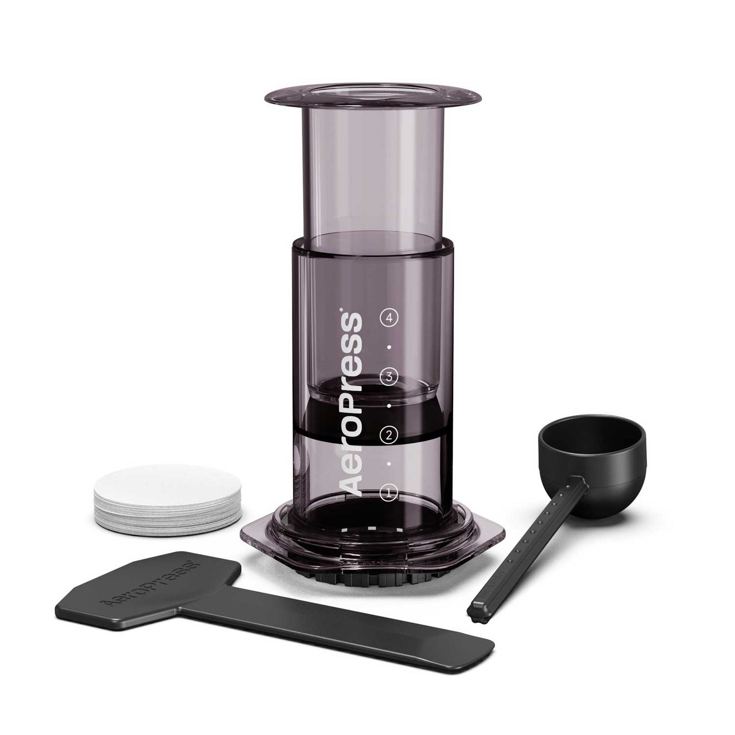 AeroPress coffee maker with components on a white background