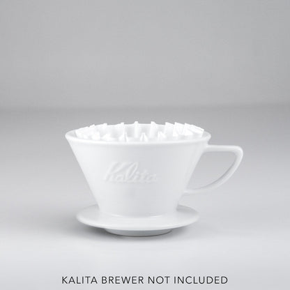 White Kalita coffee filter on a gray background with 'Kalita Brewer Not Included' text.