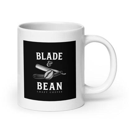 White mug with 'Blade & Bean' logo on a black background